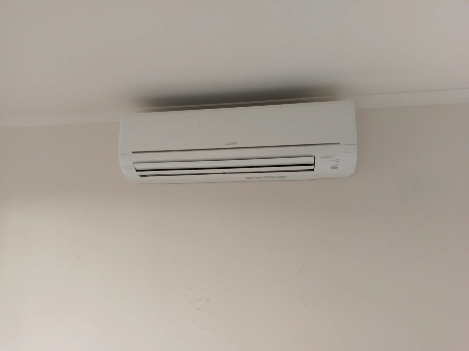 Mitsubishi Electric split system head installed in a bedroom