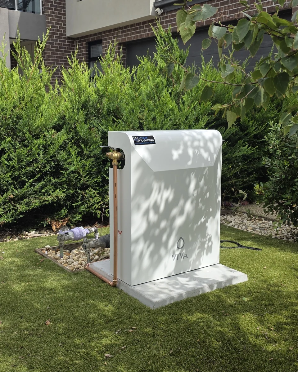 Viva whole home water filtration system installed on a concrete pad