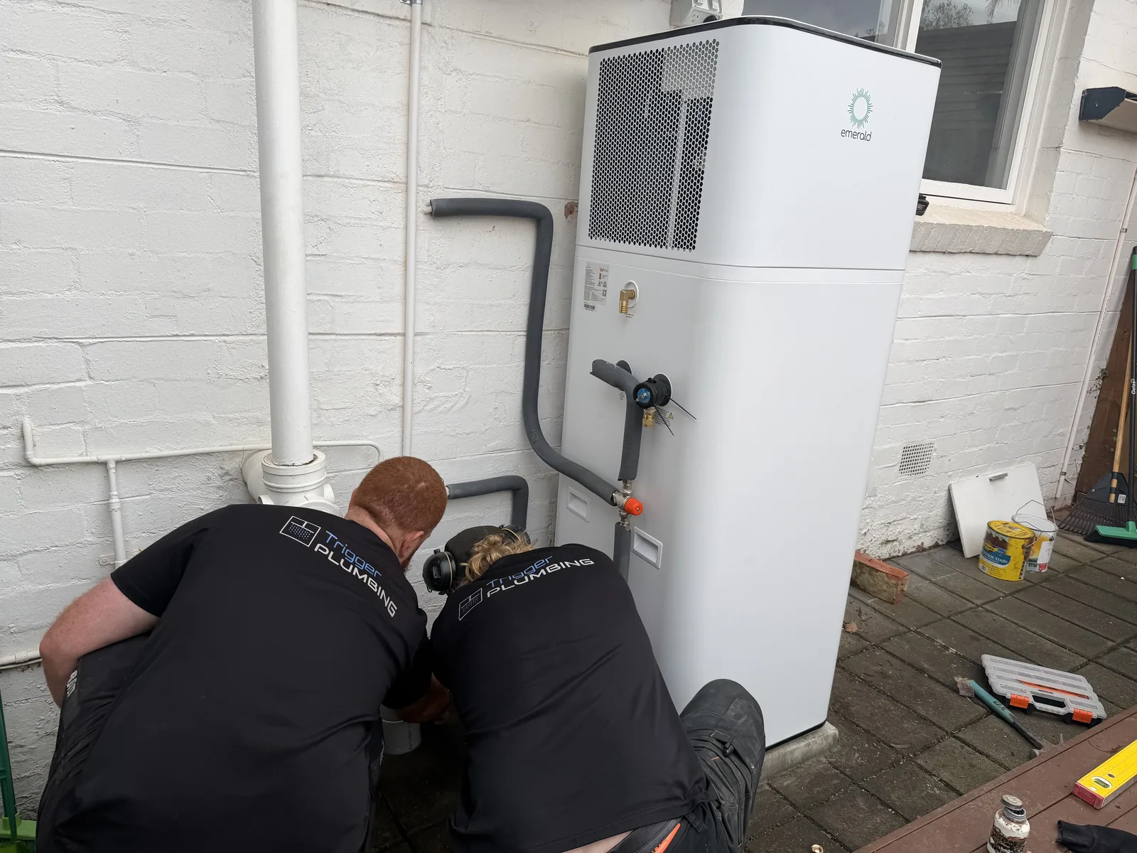 Trigger Group plumber connecting an Emerald heat pump