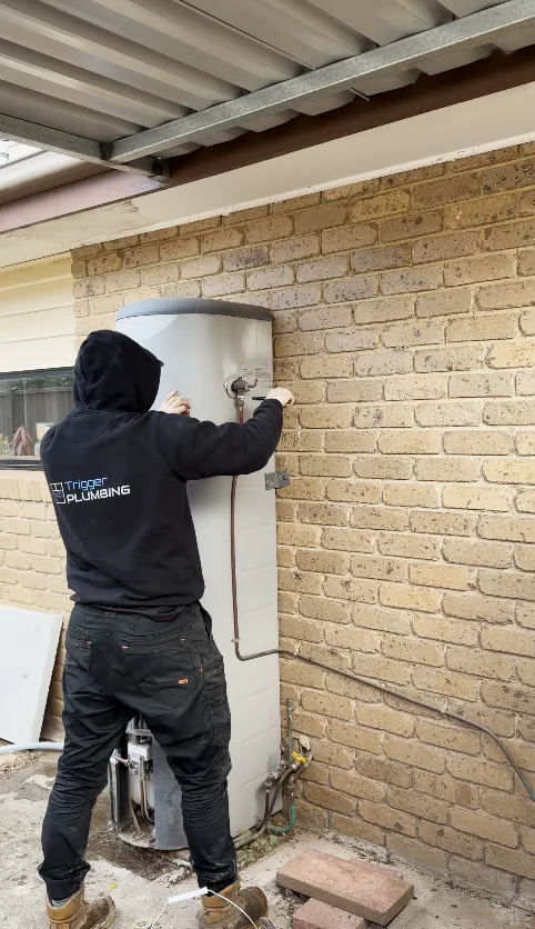 Trigger Plumbing plumber decommissioning an old gas storage hot water unit in Melbourne